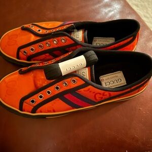 Gucci Men's Orange and Black Sneakers
Very good condition